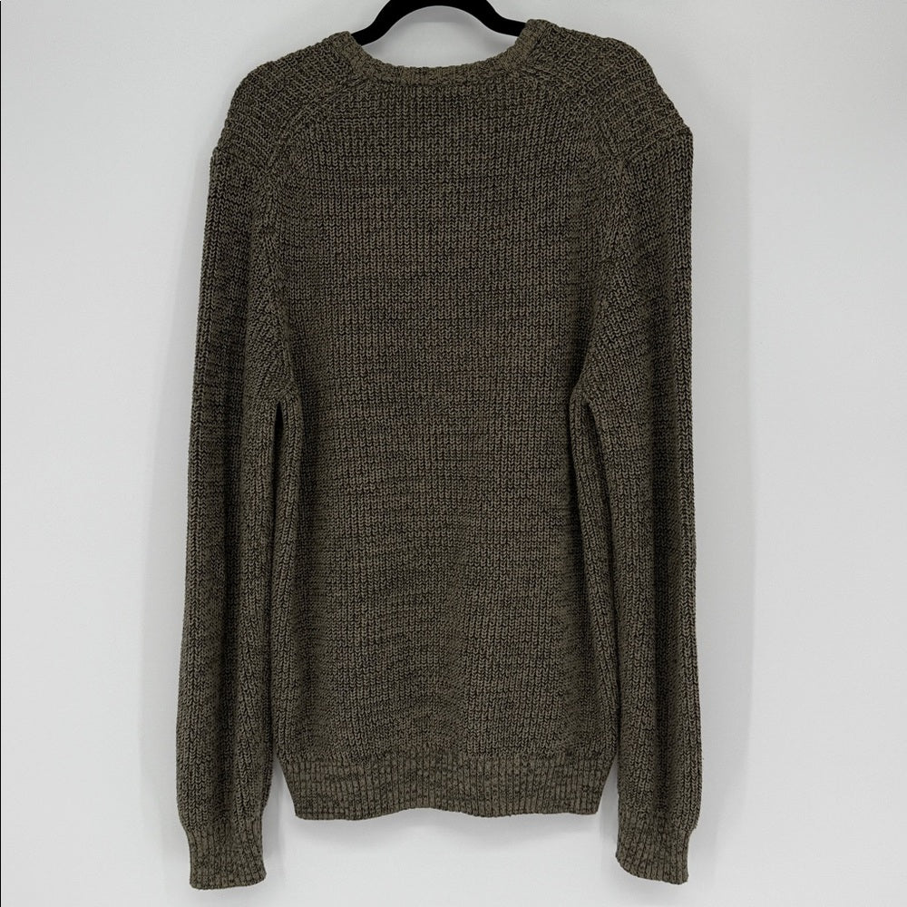 Brown knitted sweater on a hanger against a white background