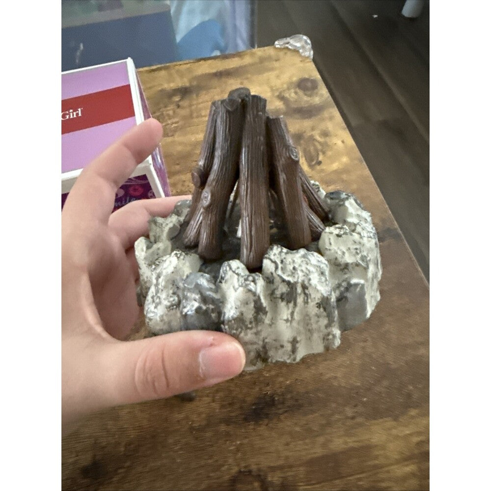 campfire doll set on table