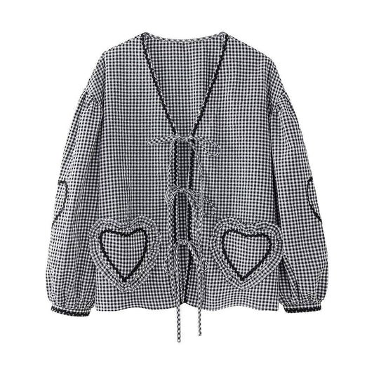 Black and white checkered jacket with heart-shaped pockets on a white background