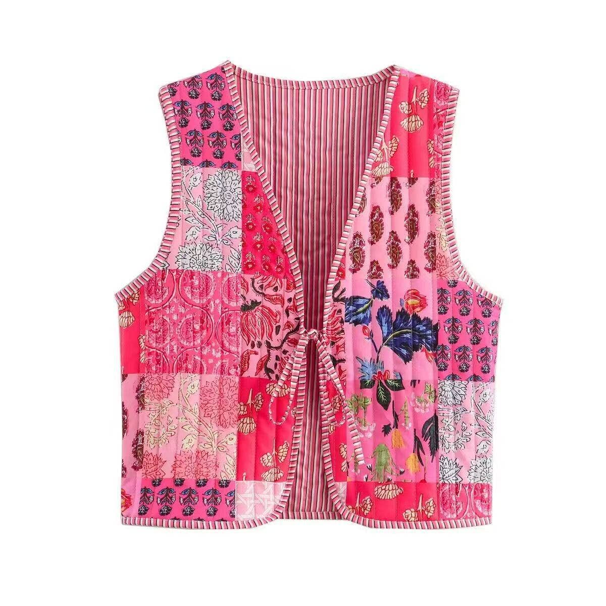 Pink patchwork vest with floral and abstract patterns on a white background