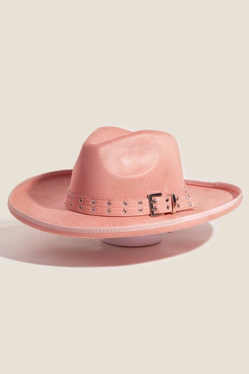 Pink buckle cowboy hat on a cream background 