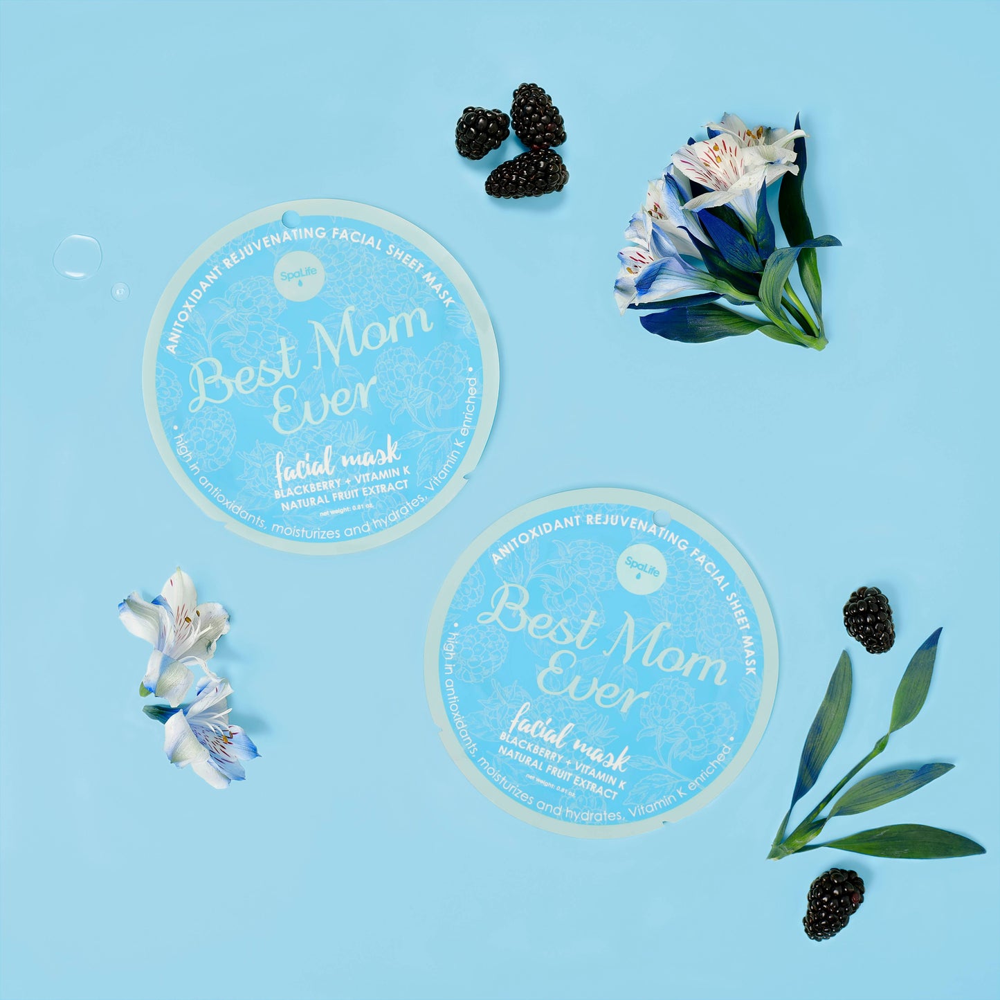 Two facial mask packs labeled 'Best Mom Ever' on a blue background with flowers and blackberries.