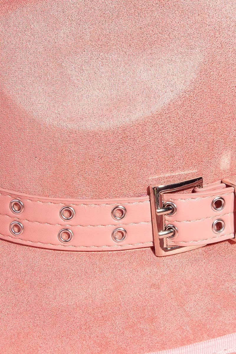 closeup of pink buckle on cowboy hat 