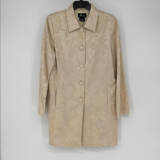 Beige coat on a hanger against a white background