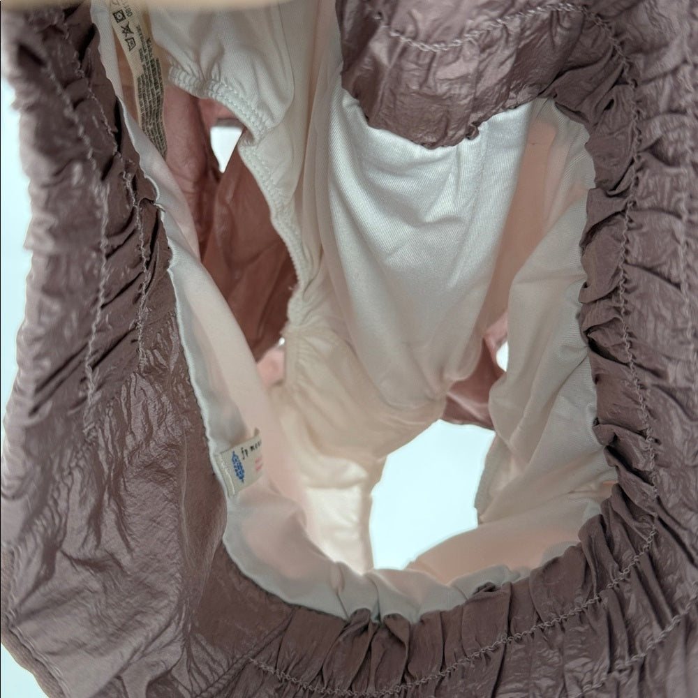 Close-up of a brown textured garment with a white inner lining.