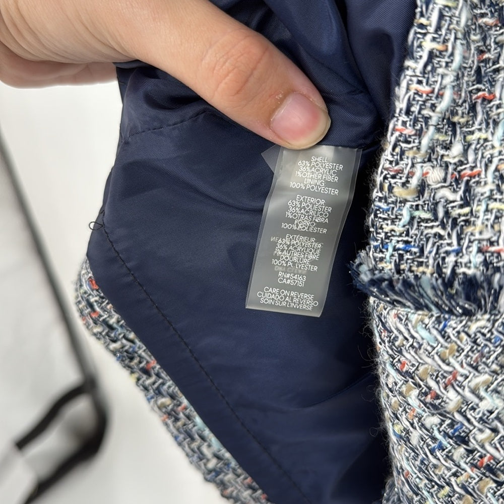 Close-up of a jacket label with a textured fabric background