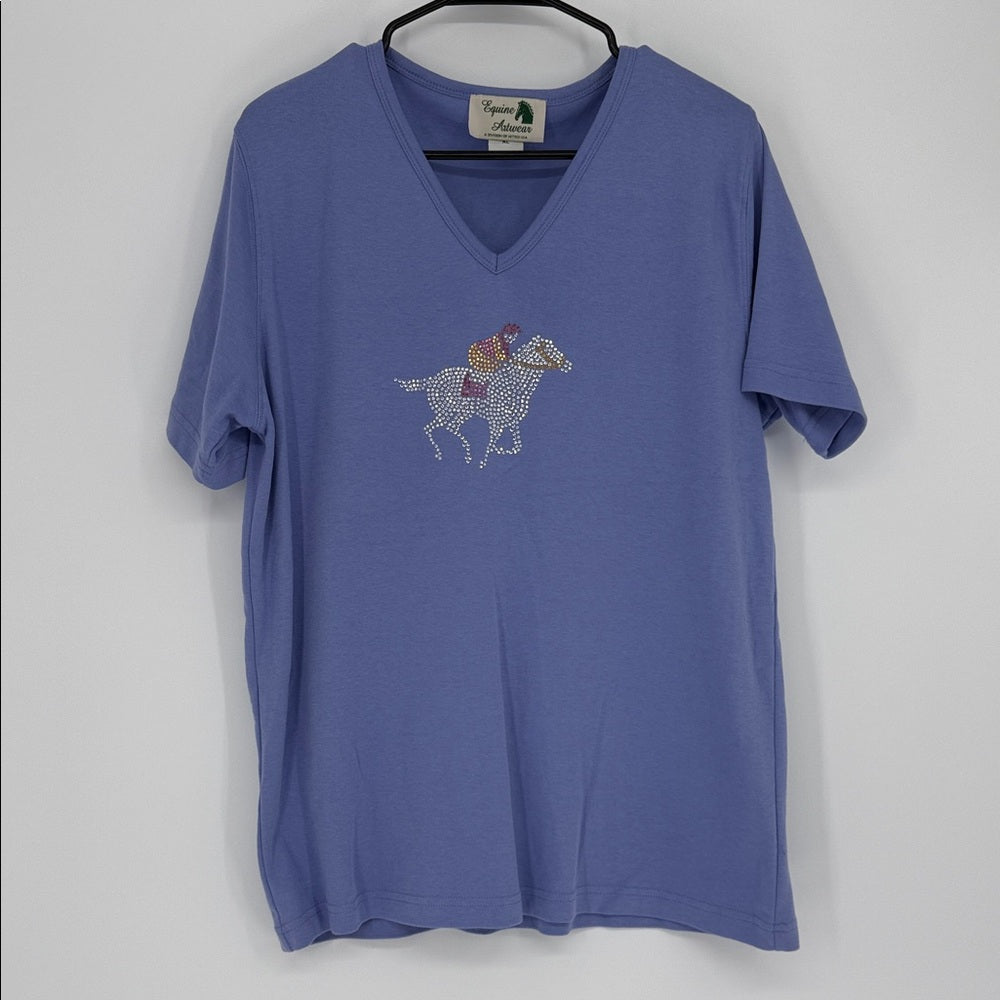 Blue t-shirt with horse and rider graphic on a hanger against a white background