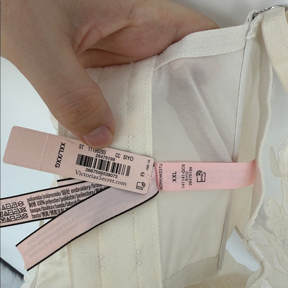 Close-up of a garment with tags, focusing on the brand label.