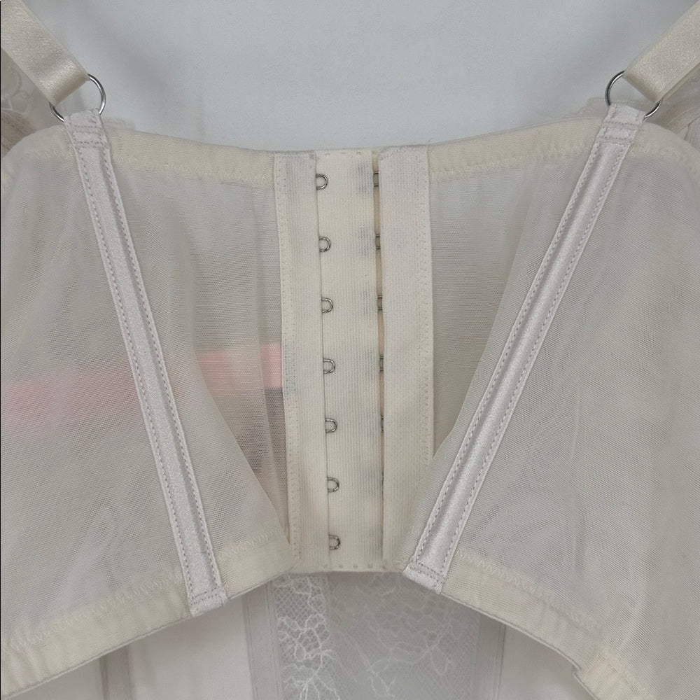 White corset with mesh panels on a white background