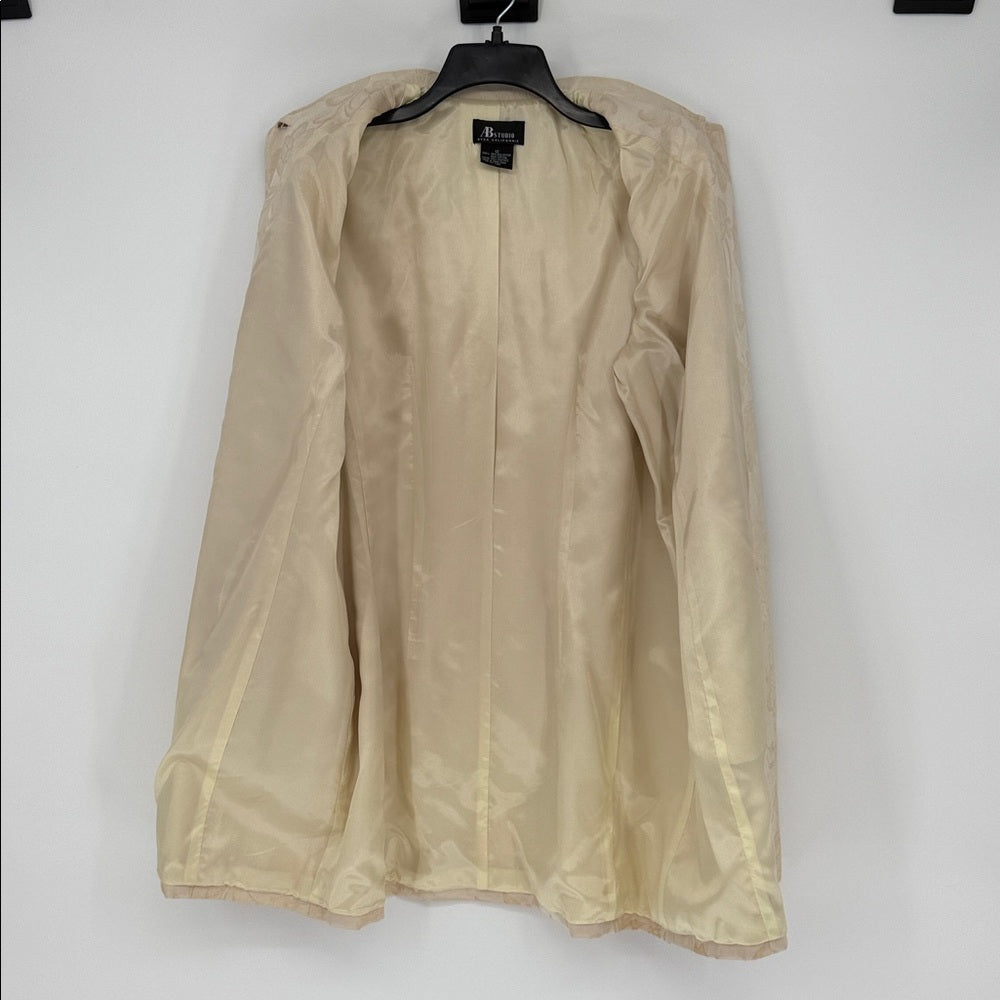 Beige jacket on a hanger against a white background