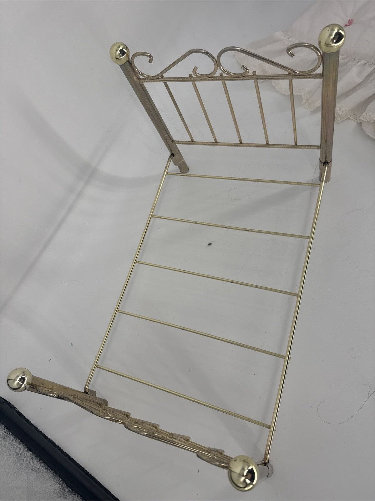 Gold metal magazine rack on a white background