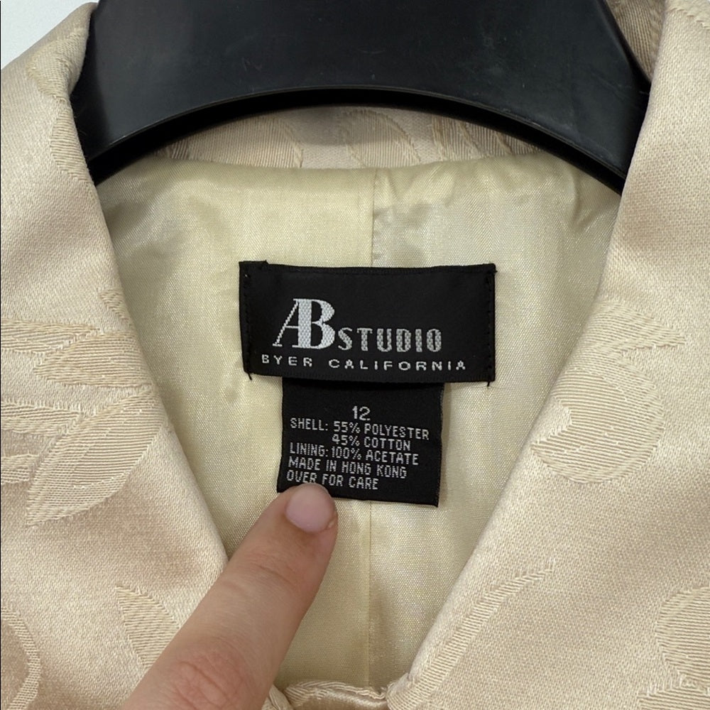Label on a beige garment with 'AB Studio byer California' branding