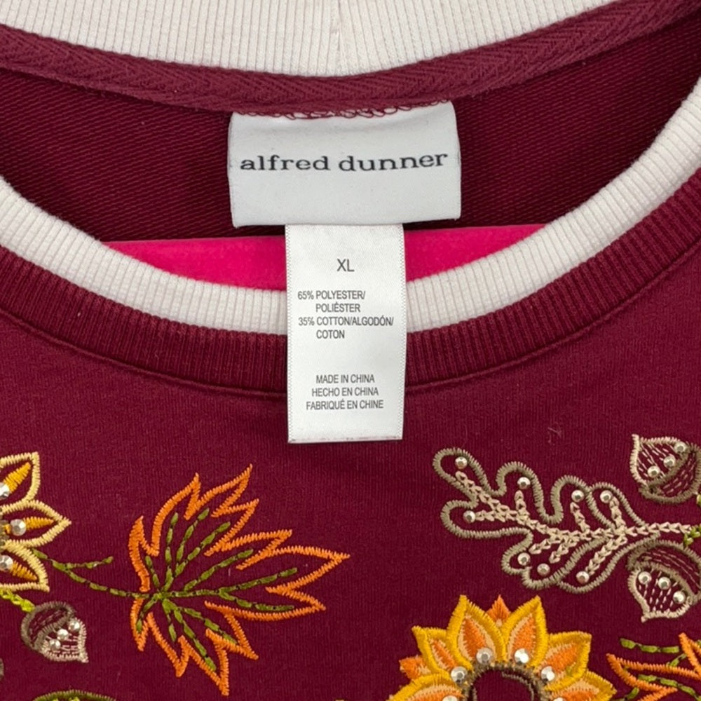 Maroon sweater with floral embroidery and 'alfred dunner' label