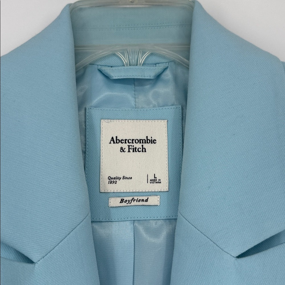 Light blue jacket with Abercrombie & Fitch label on a white background