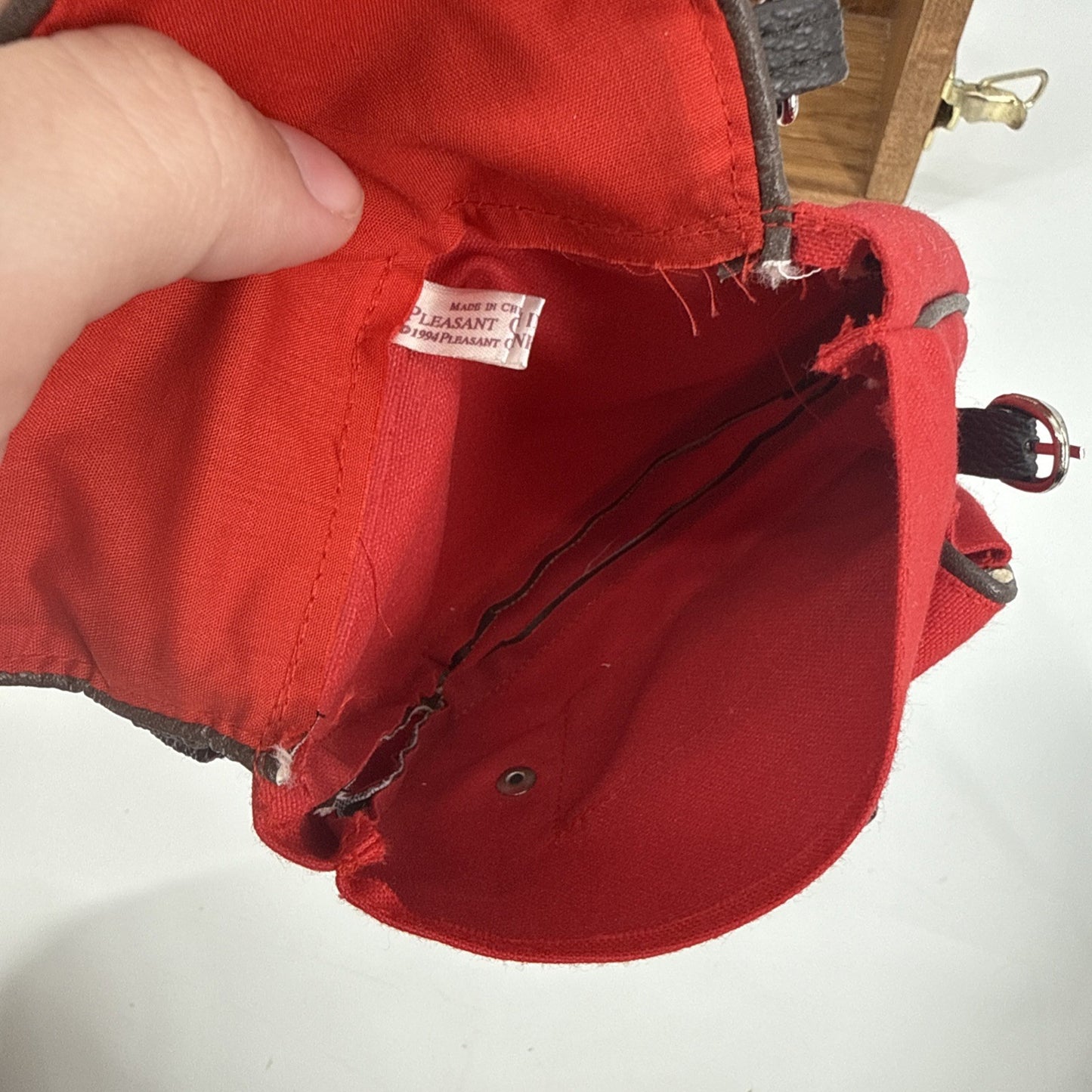 Red cap with a visible brand label on a white background