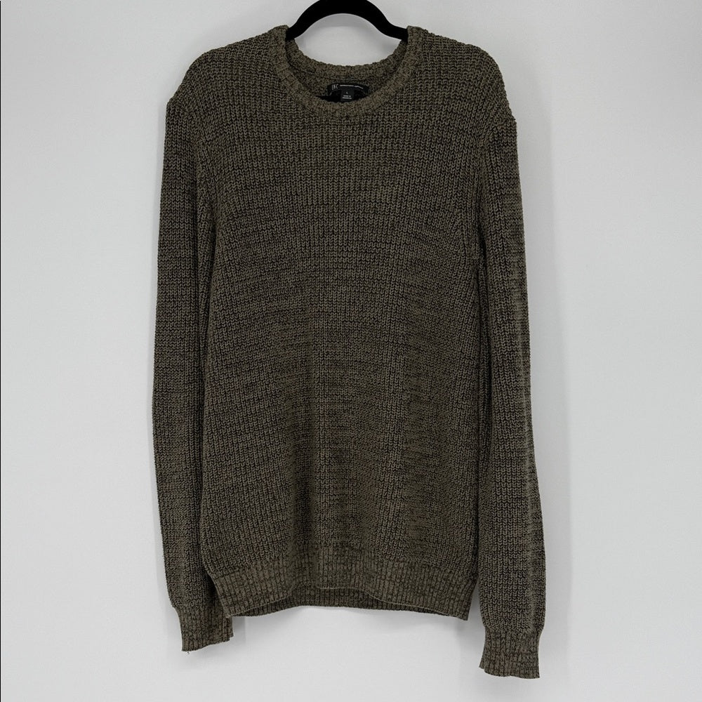 Brown knitted sweater on a hanger against a white background