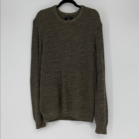 Brown knitted sweater on a hanger against a white background