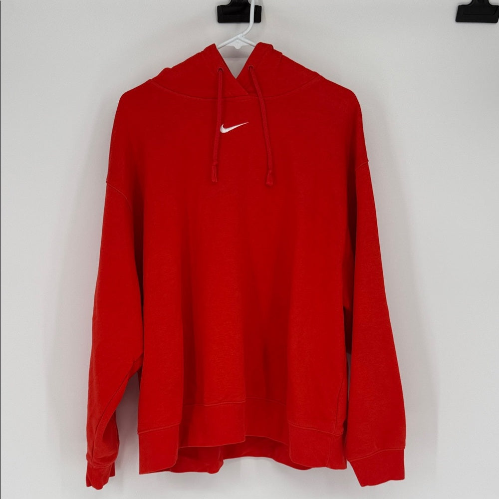 Red hoodie with a Nike logo on a white background