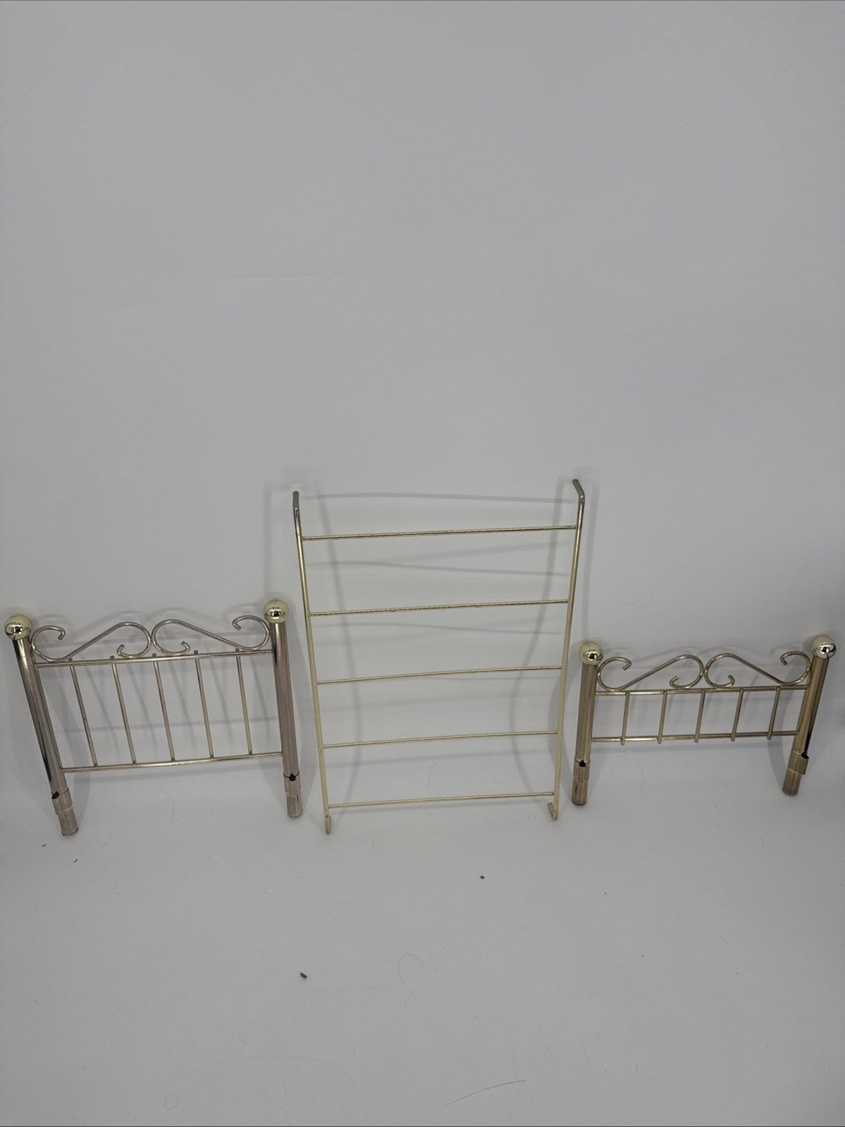 Three metal headboards on a white background