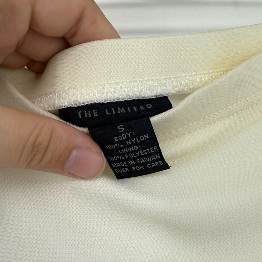 Close-up of a label on a garment with 'The Limited' branding.
